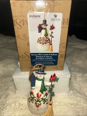 Jim Shore Snowman ornament with cardinals and birdhouse.